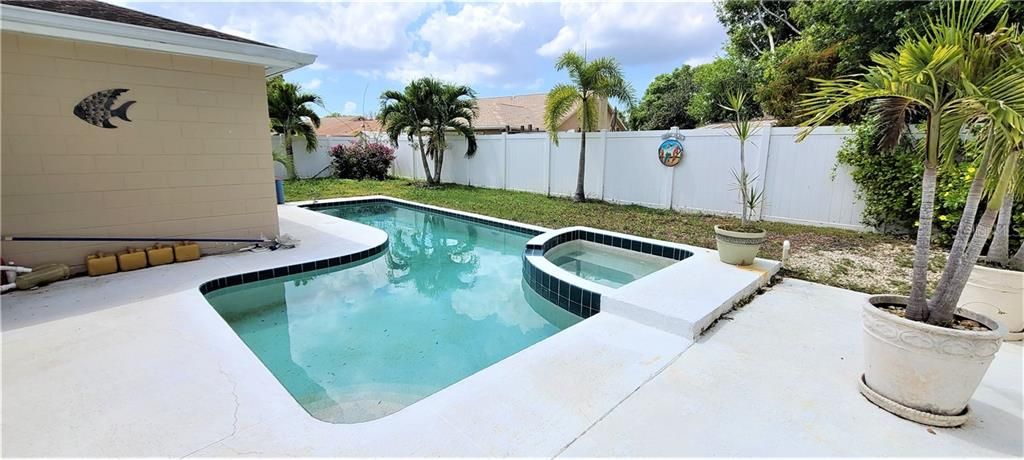 Pool with spa and large deck area for entertaining.  Yard has all PVC fencing.