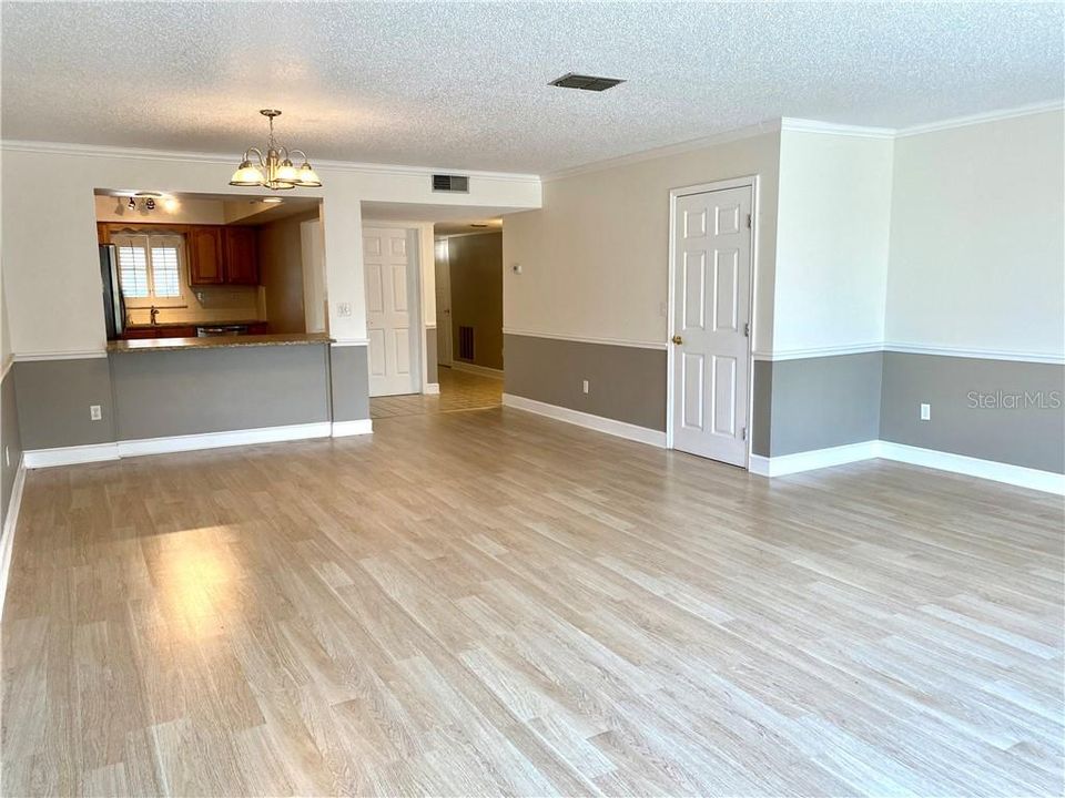 Oversized living/great room equipped with newer laminate flooring