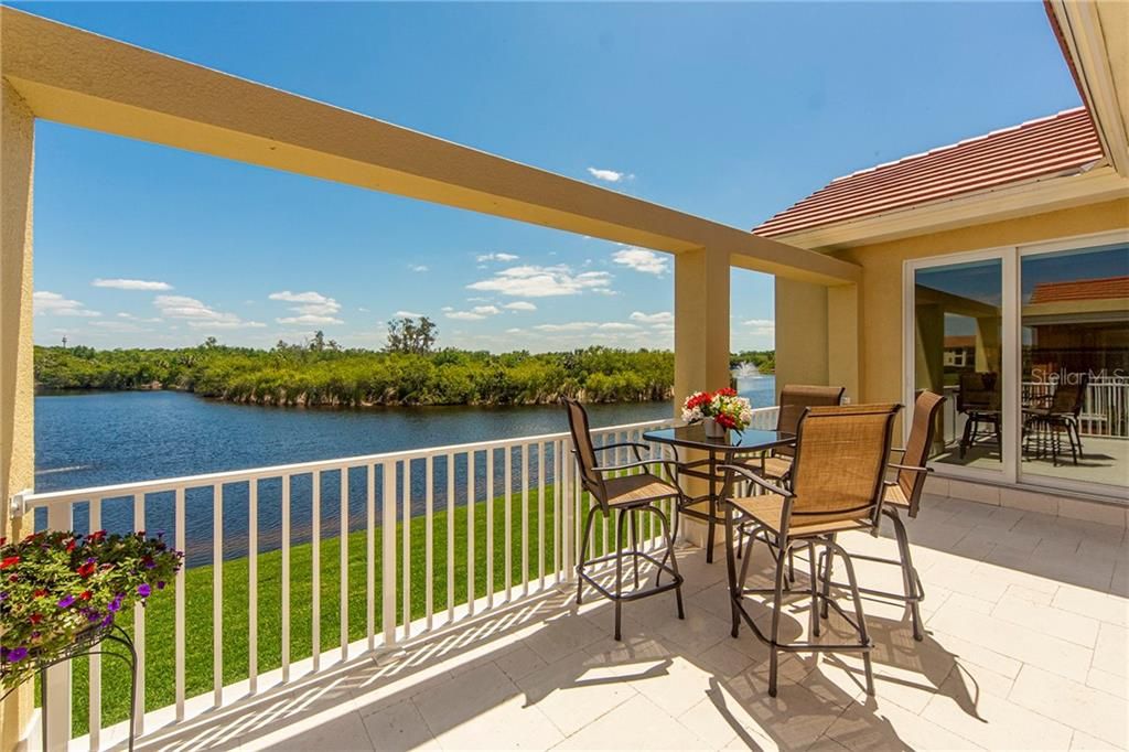 Open terrace on main living level, overlooking preserve and pond.
