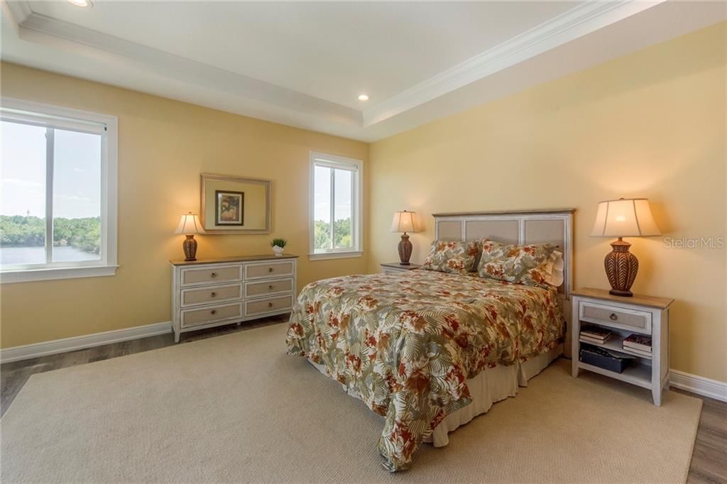 Oversized Master Bedroom with tray ceilings and gorgeous views of the preserve.