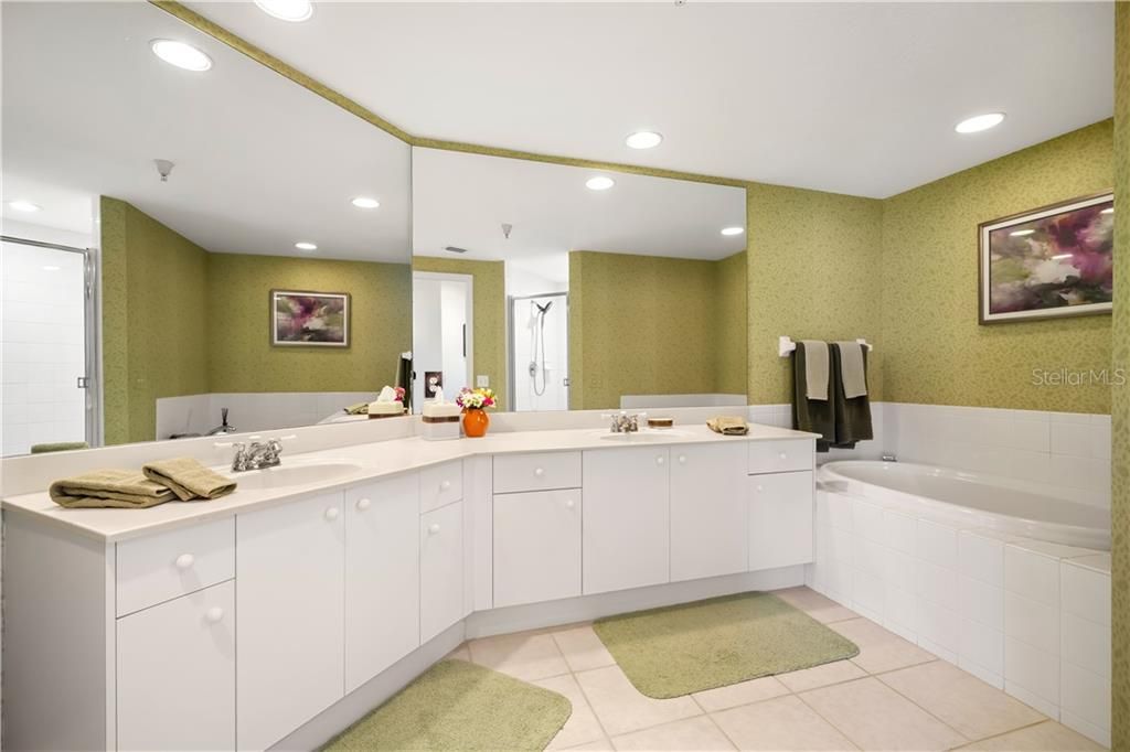 Large master bath has double vanity, garden tub and walk in shower.
