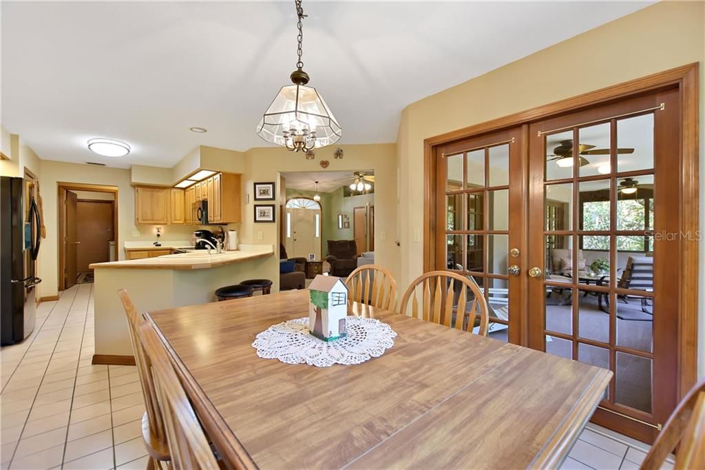 Dining room opens directly to the kitchen with the living room just a few steps away and the screened lanai too.