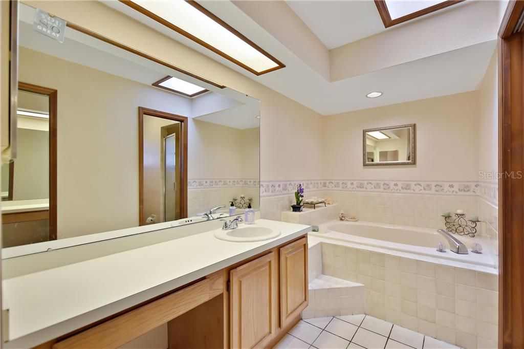 Master bath has soaking tub, walk-in shower, a separate water closet and a large walk-in closet.