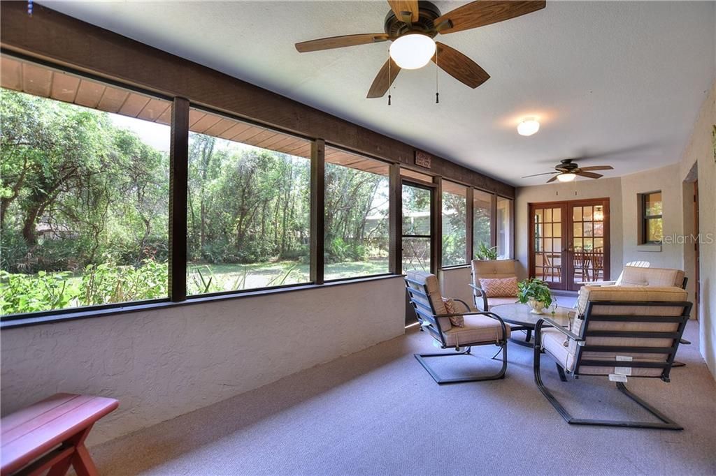 Enjoy the privacy of your backyard view with mature oaks, and Florida friendly native landscaping.