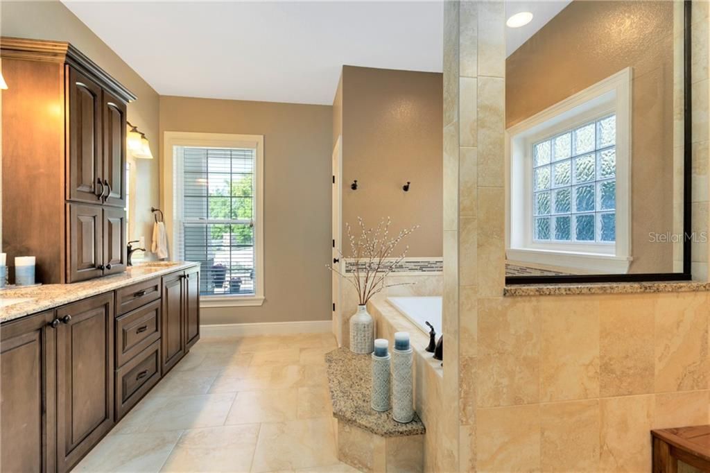 Remodeled Master Bathroom with Large Shower, Tub, Double Sinks and Custom Cabinetry