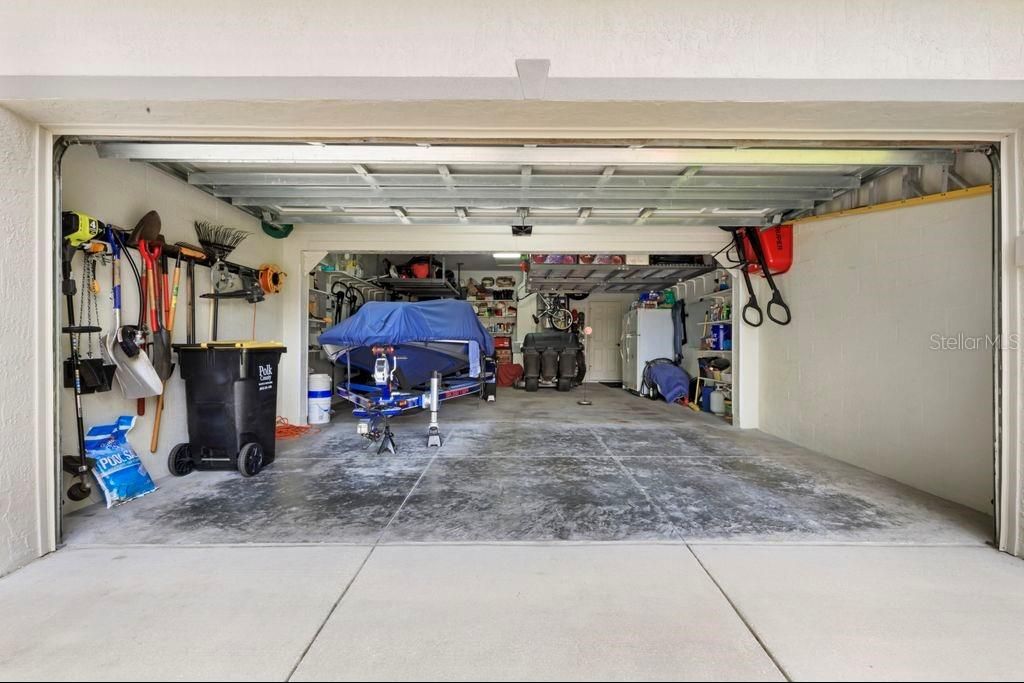 Large 34 x 21 Garage w/ 2 Attic Spaces and ceiling Racks