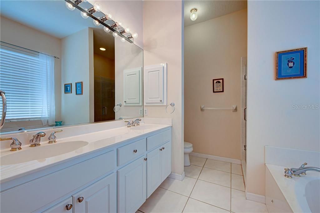 Ensuite master bathroom with dual vanities and walk in shower.
