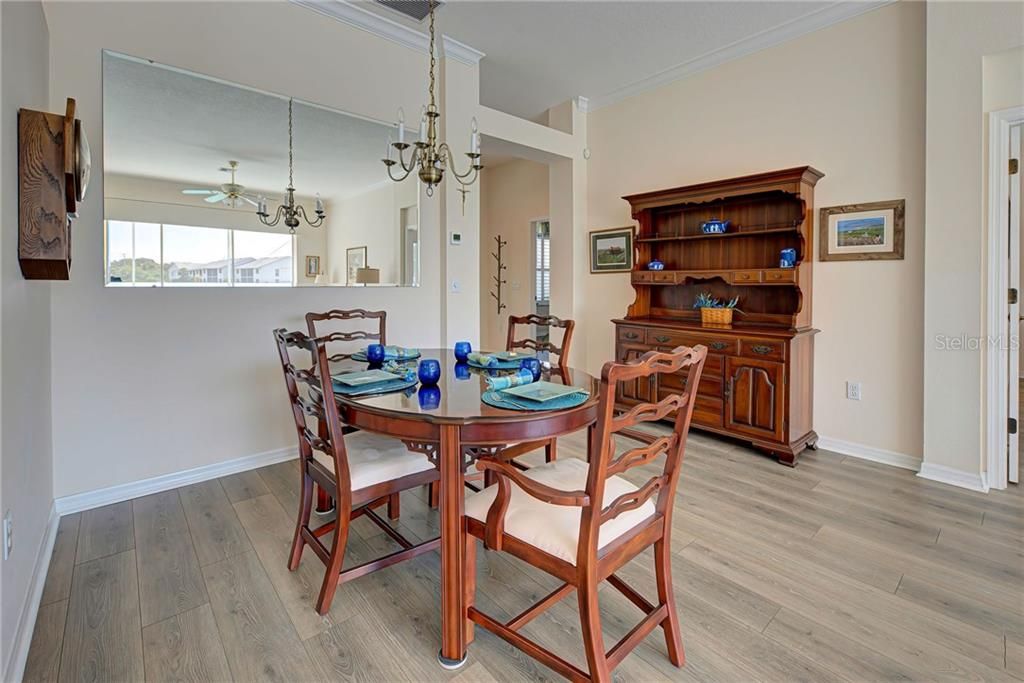 Dining room just off of kitchen...just the right size to enjoy a meal with new friends