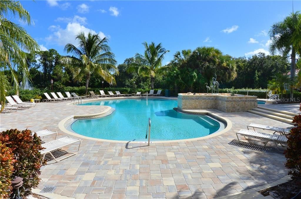 Year round heated community pool to relax in, under swaying palm trees....ahh!