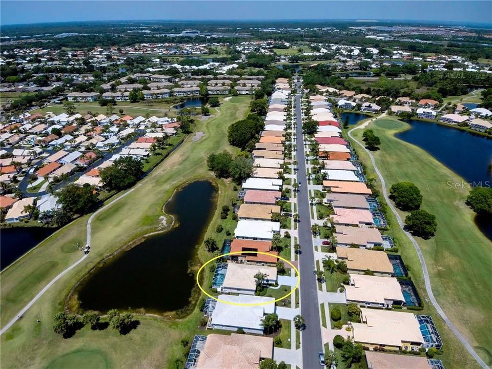 Birds eye view of home with water and golf views....wonderful!