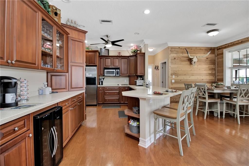 Kitchen with Breakfast Bar, Stainless Steel Appliances and wine Refrigerator