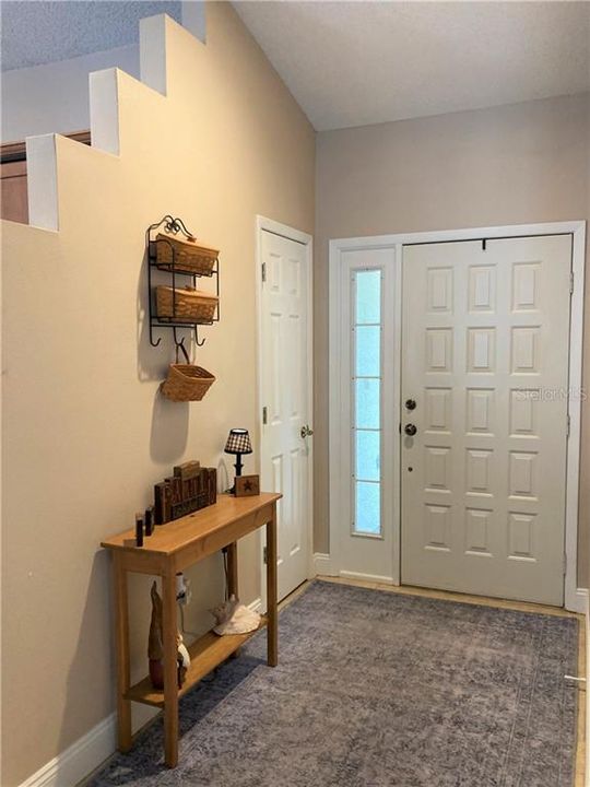 Entryway with coat/utility closet