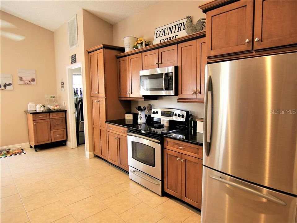 The kitchen has been totally updated with solid maple cabinets and granite countertops