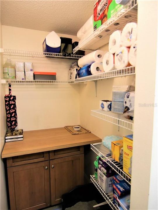 Additional pantry/storage in utility room off kitchen.