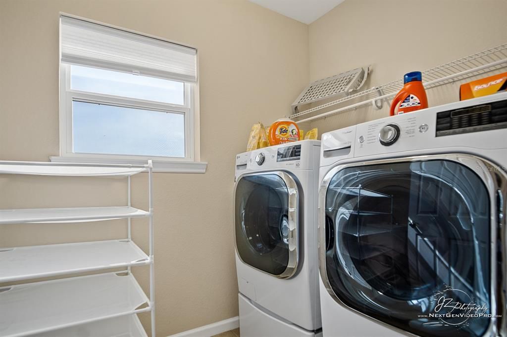 The laundry room is upstairs and has a window for natural light and newer washer & Dryer.