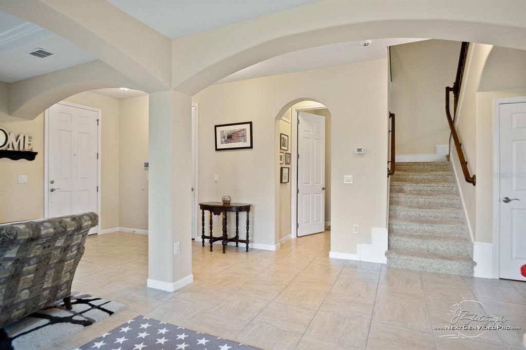 An elegant entry hall opens to formal areas.