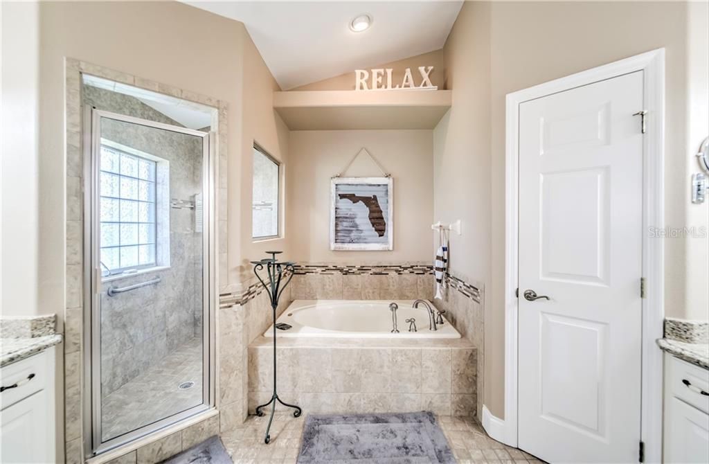 Soaker tub, separate shower, his and her sinks. Privacy water closet