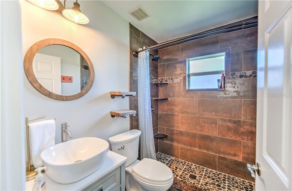 updated and upgraded modernized guest bathroom