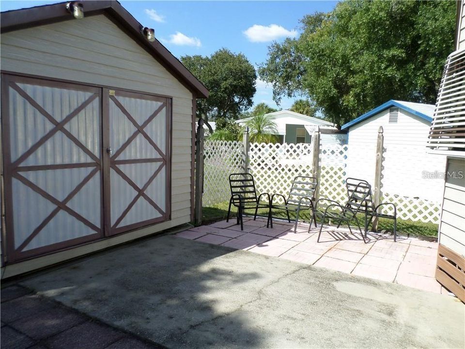 Rear patio area with 12'x12' air conditioned shed.