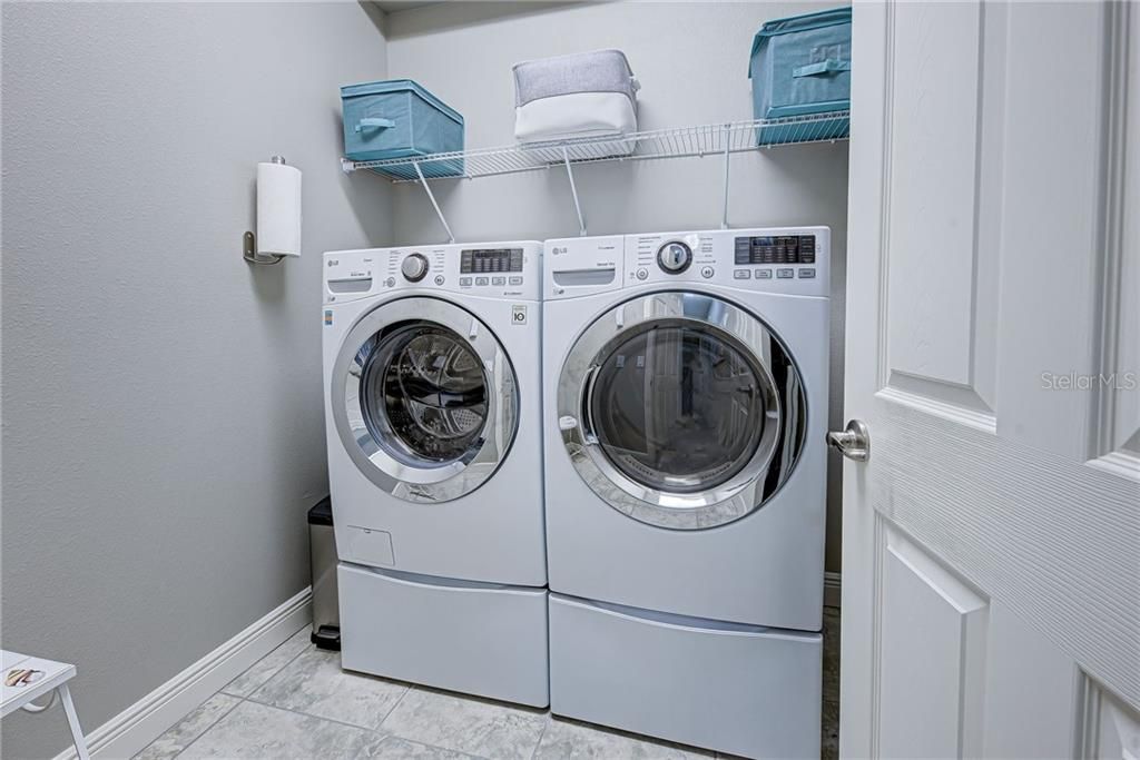 Laundry room with top end washer & dryer