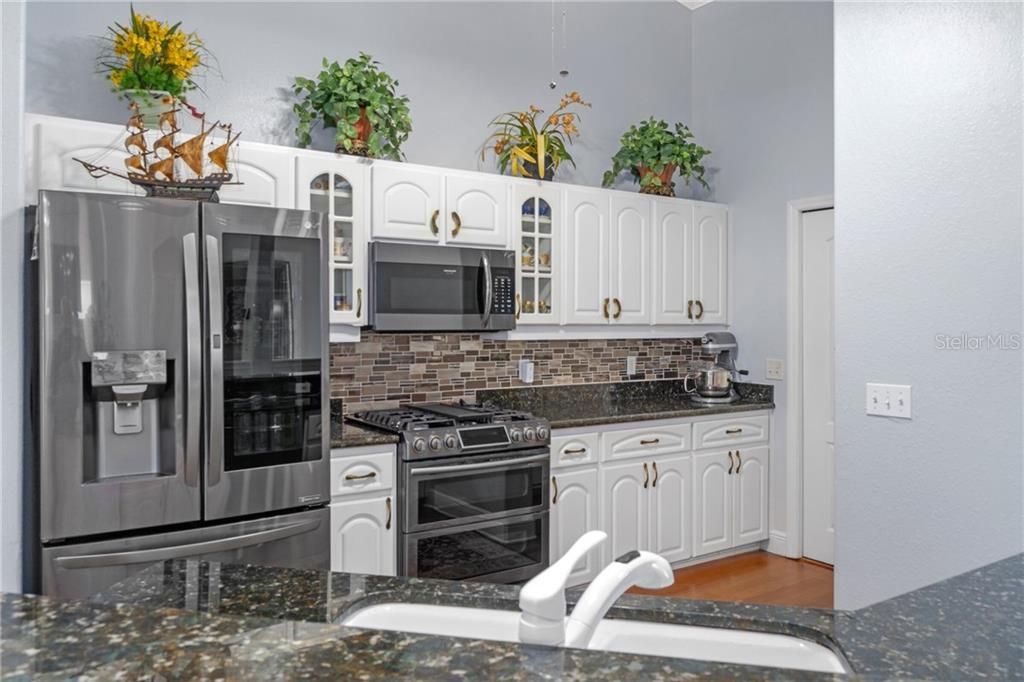 Kitchen with Granite Counter Tops and Stainless Appliances