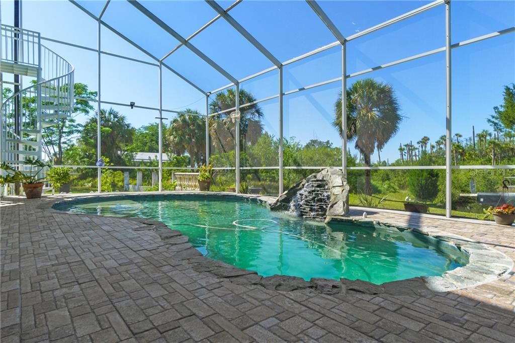 Beautiful Screened Pool with Waterfall and Paver Patio