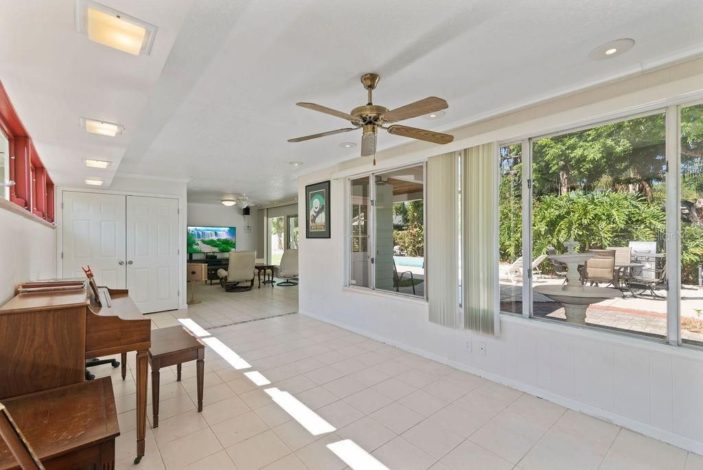 Light-filled breezeway with view into family room.