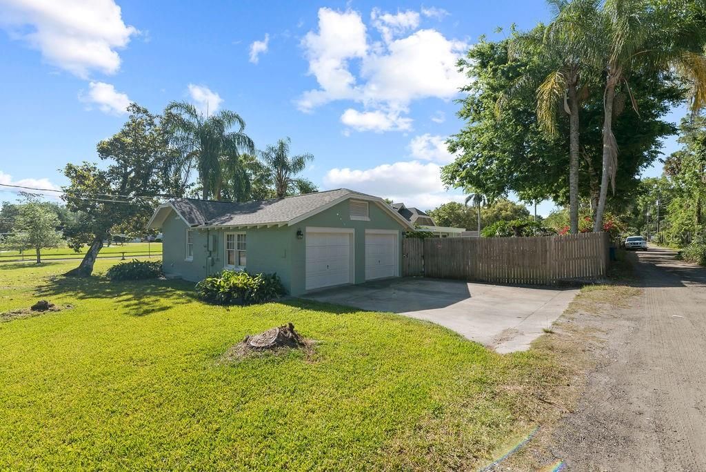 Attached garage and driveway off of alley.