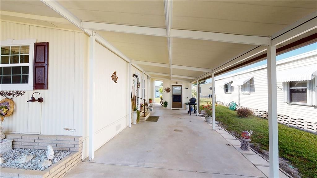 Large carport big enough for 2 cars or a car and a golf cart