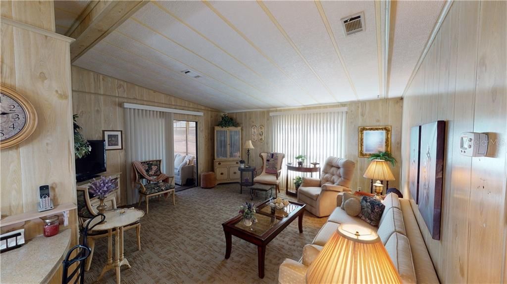 Nice large living room with Florida room off the side.