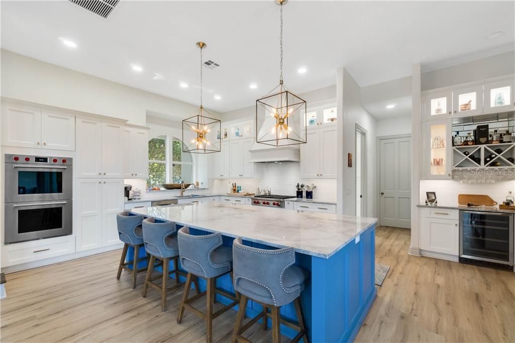 OPEN CONCEPT KITCHEN WITH WALK IN PANTRY AND WINE BAR MAKE THIS A PRIME GATHERING SPOT