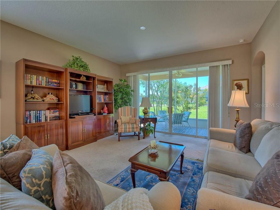 Sleek open design with volume ceilings, 4 panel 8' sliding doors bring in that Florida sunshine!