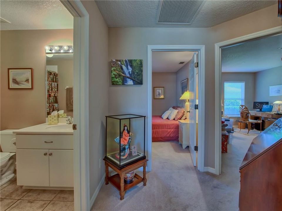 Private guest wing hallway has access to the two extra bedrooms and bath!