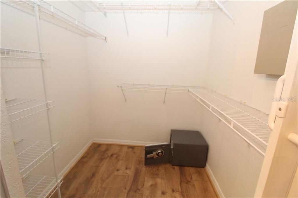Master Bedroom walk-in closet... safe will stay but current owners are not sure of the combo...