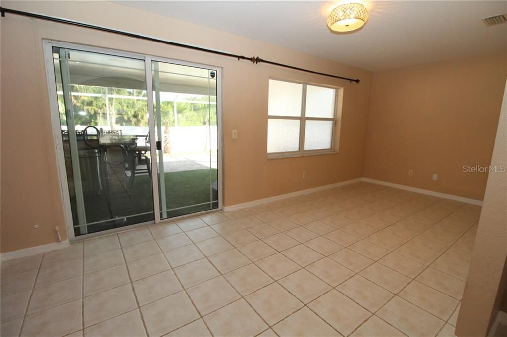 Den/Office with tile flooring. Vaulted ceilings... Sliding glass door out into the Lanai.
