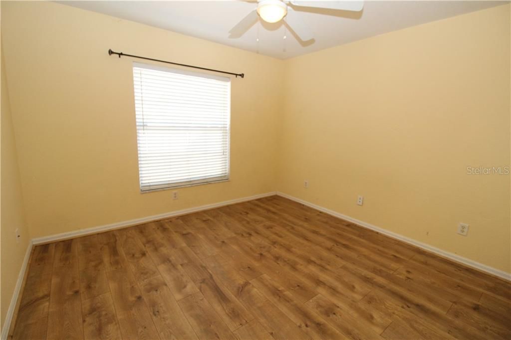 Bedroom #2 with newer laminate wood flooring...