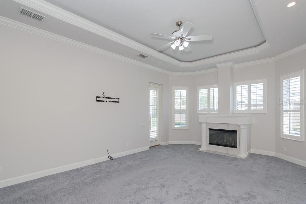Owner's Retreat with Tray Ceiling, Up Lighting, Crown Molding and Plantation Shutters
