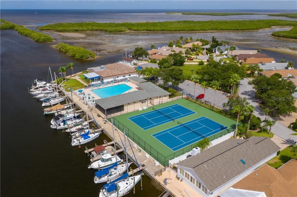 Community tennis courts, pool, clubhouse and boat ramp.