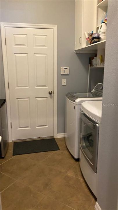 Laundry room with added shelves