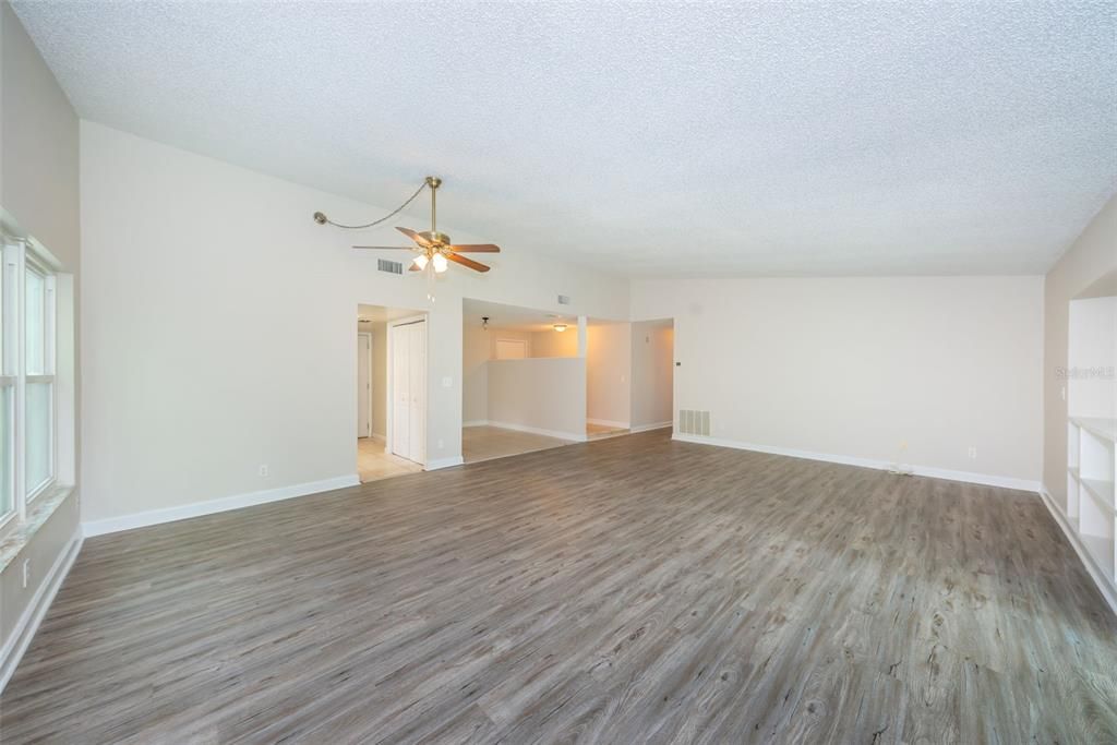 Open living/great room with new vinyl plank flooring and fresh interior paint