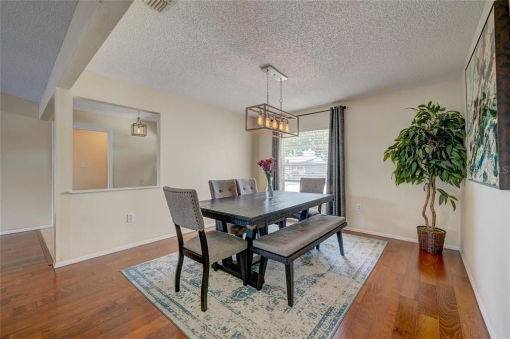 Formal dining room at the front of the home -- this space could be re-purposed as the home office you've been wanting... the option is yours!