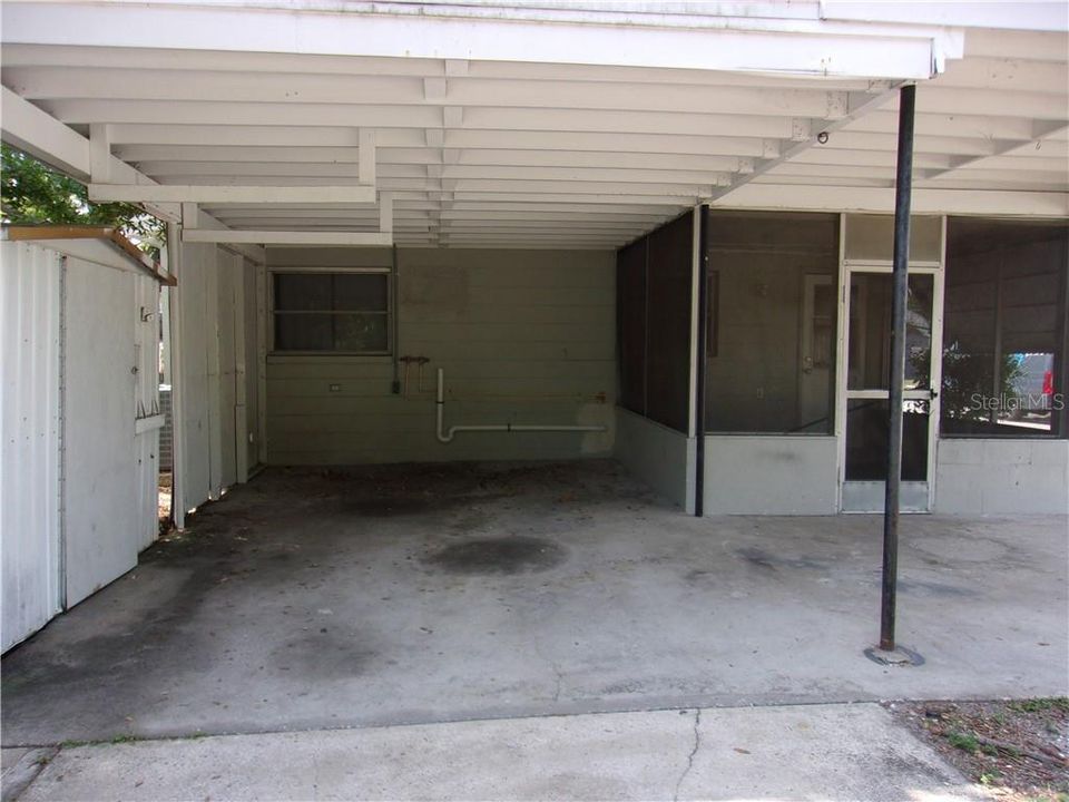 One-car carport with access to the rear of the home