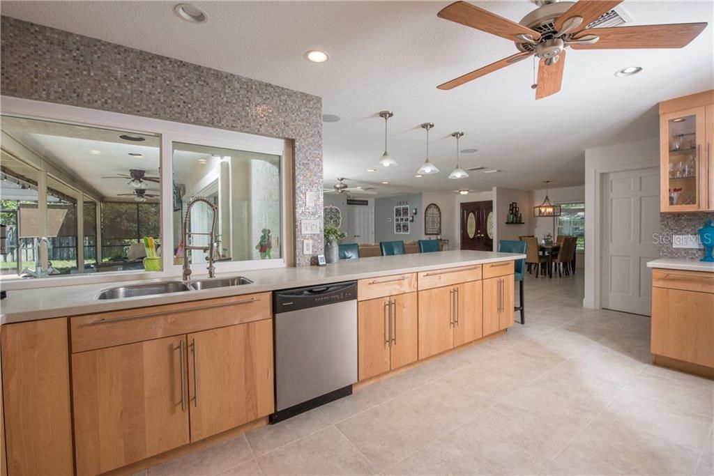 Dream Kitchen with convenient pass through to pool area.
