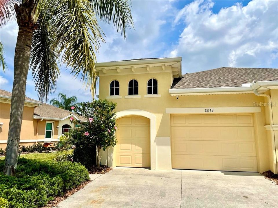 Front of home. 1 car garage plus golf cart garage.  Lots of cabinets for storage!