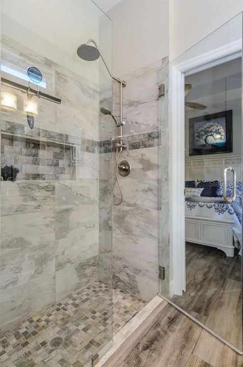 The master shower has built in shelves and a rain forest shower head.