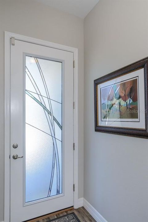 The front door has a simple and beautiful design that allows the Florida sun to shine in.