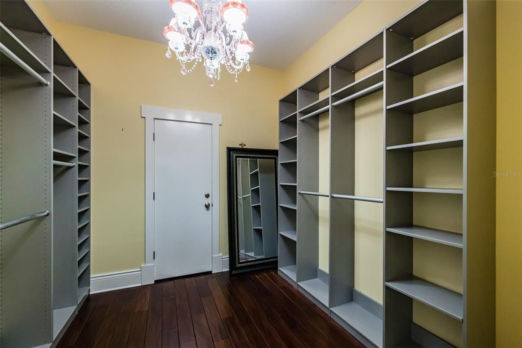 MASTER WALK IN CUSTOM CLOSET - DOOR IN THE MIDDLE IS A SECRET LOCKED SECURED AREA BIG ENOUGH FOR A SAFE