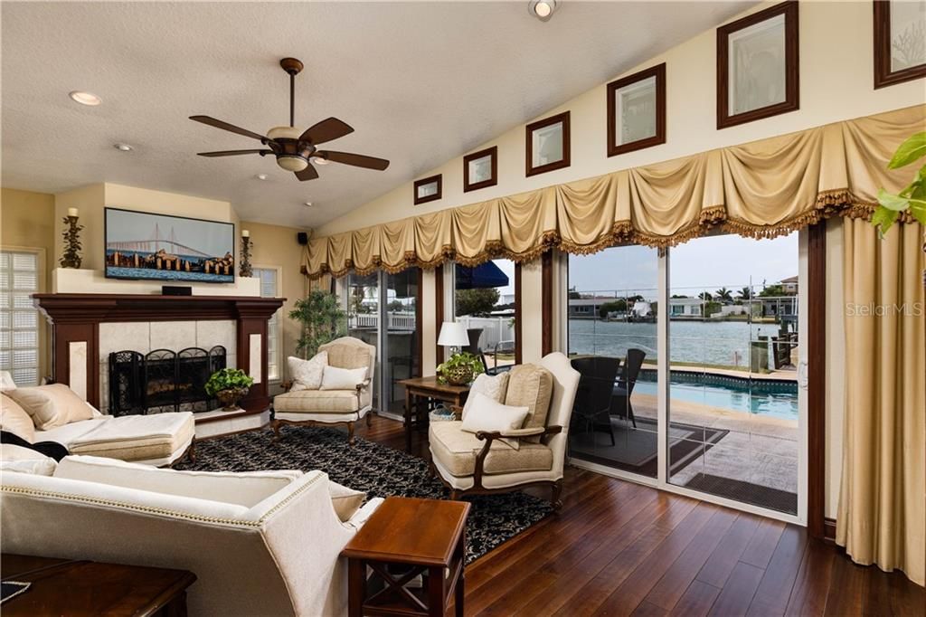 Living area overlooking the lanai, pool and water- Gorgeous!!!