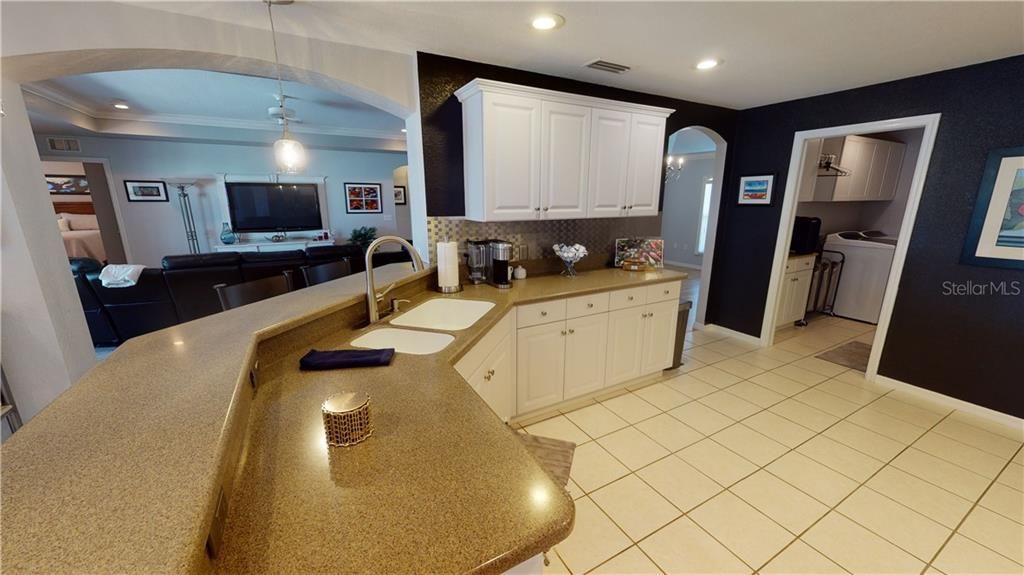 Spacious kitchen with Corian counter tops.