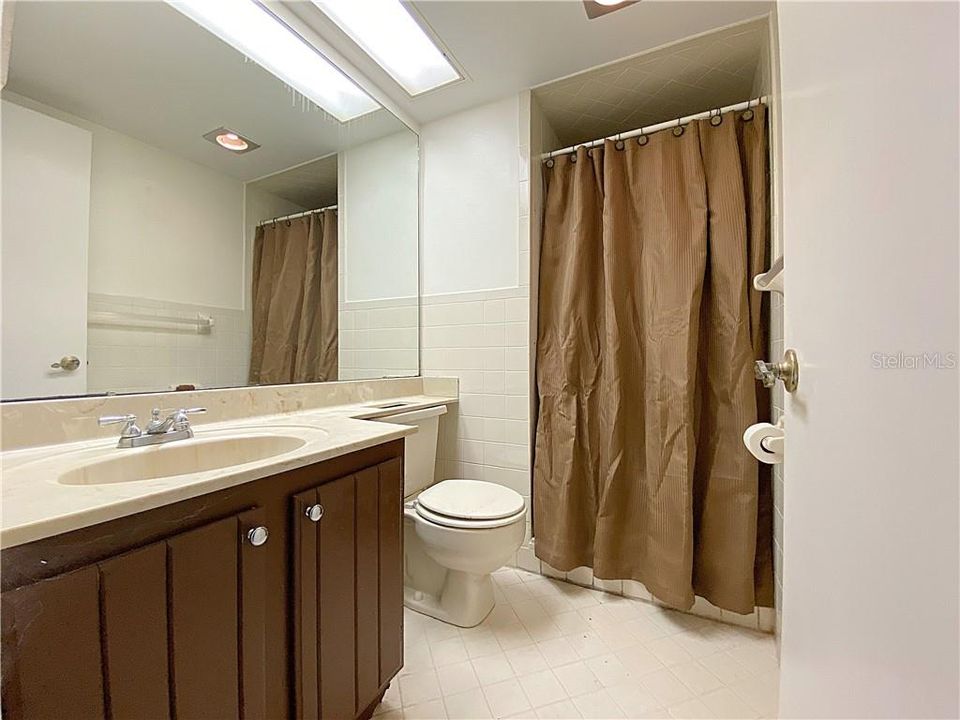 Guest bathroom offers a walk-in shower